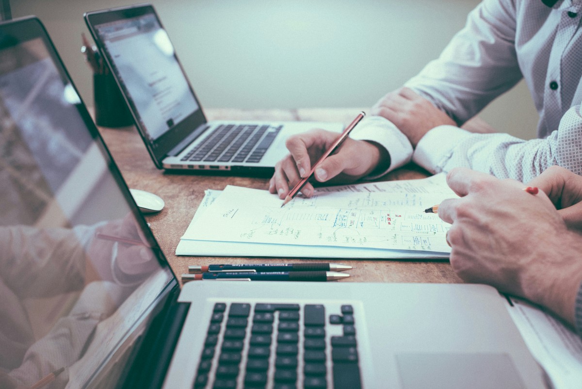 Reviewing marketing performance reports at a laptop