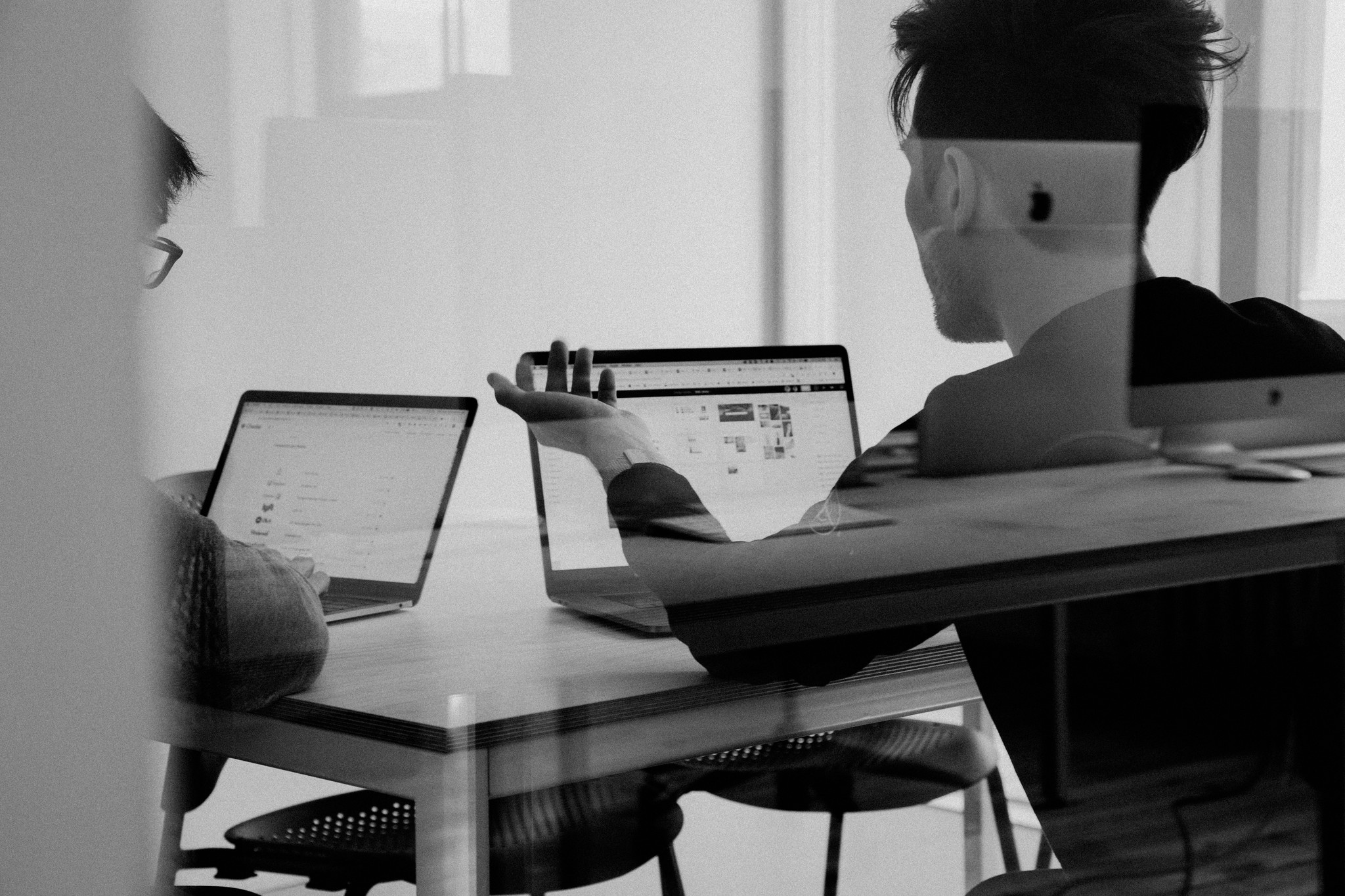 Team reviewing campaign work on laptops